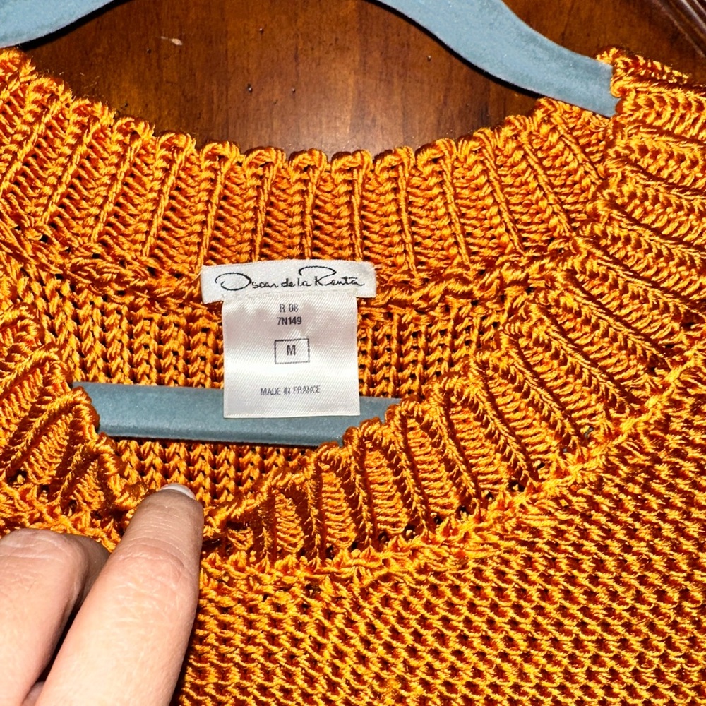 This pretty sweater has been used only twice this is a good one piece.